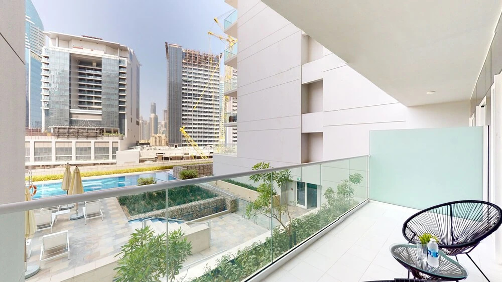 Дубай: WelHome - Cozy 1BR With Private Balcony Steps From the Canal