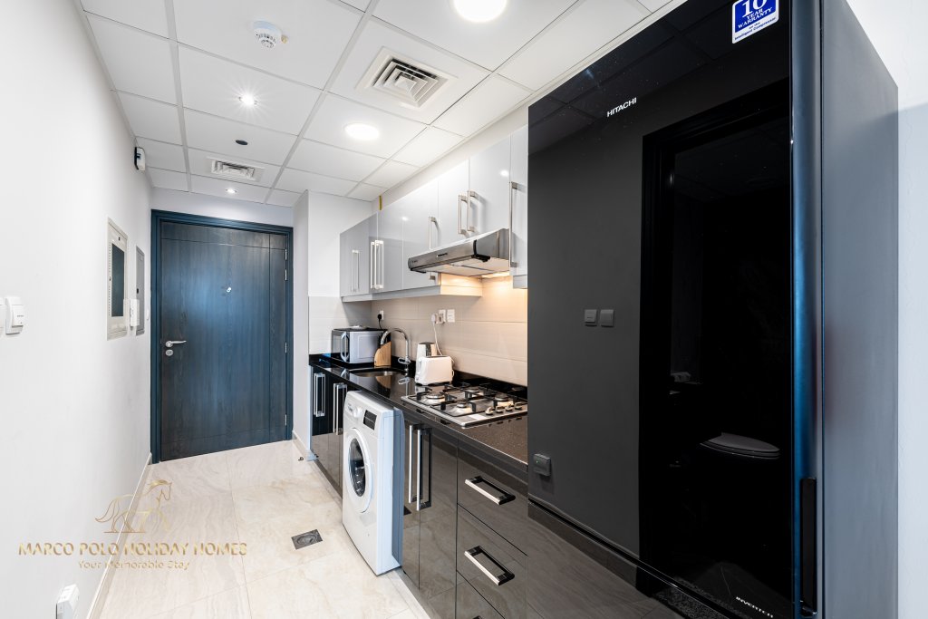 Дубай: Апартаменты Marco Polo - Sleek Studio With Lake And Burj Khalifa Views