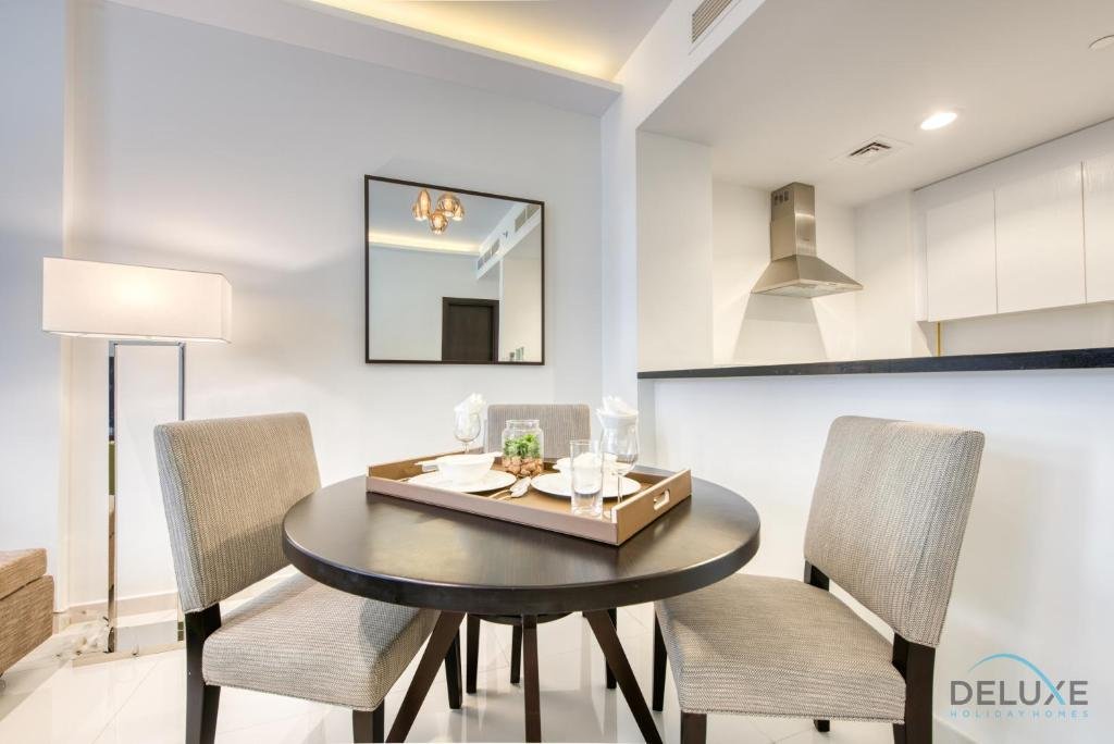 Дубай: Sleek 1BR Apartment at Celestia Dubai South by Deluxe Holiday Homes