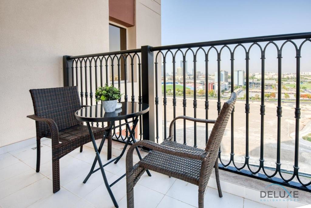 Дубай: Sunny 1BR at Canal Residences West Dubai Sports City by Deluxe Holiday Homes