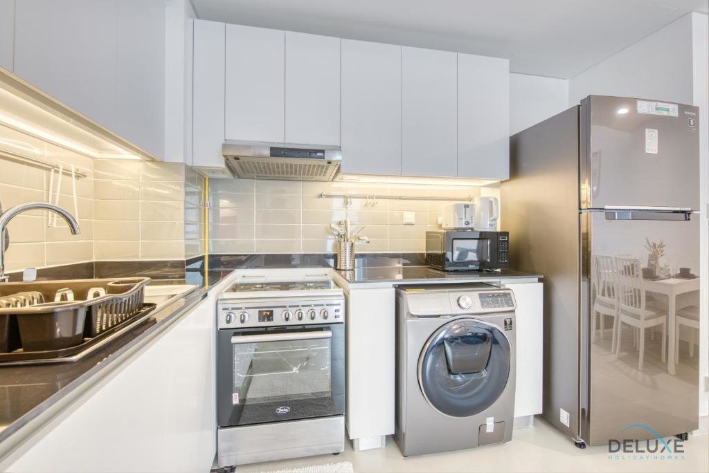 Дубай: Innovative 1 BR Apartment at Pulse Residence Dubai South by Deluxe Holiday Homes