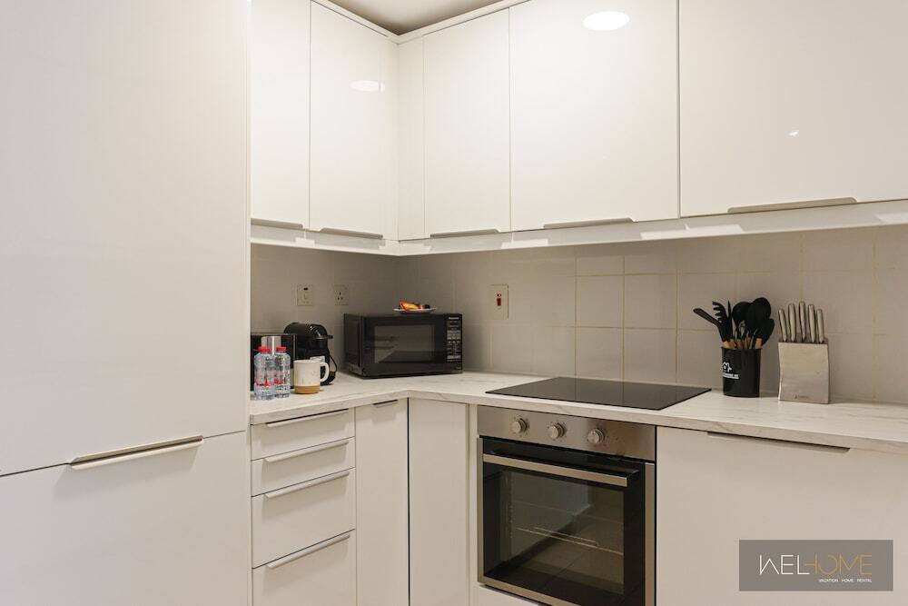 Дубай: WelHome - Mesmerizing 1BR Apartment in Damac Waves A