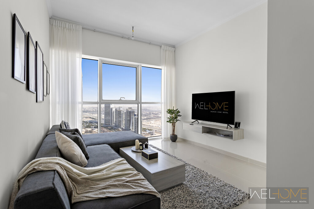 Дубай: Апартаменты WelHome - Breathtaking 1BR Apt with Balcony and City View