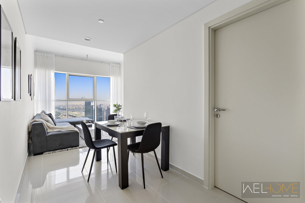 Дубай: Апартаменты WelHome - Breathtaking 1BR Apt with Balcony and City View