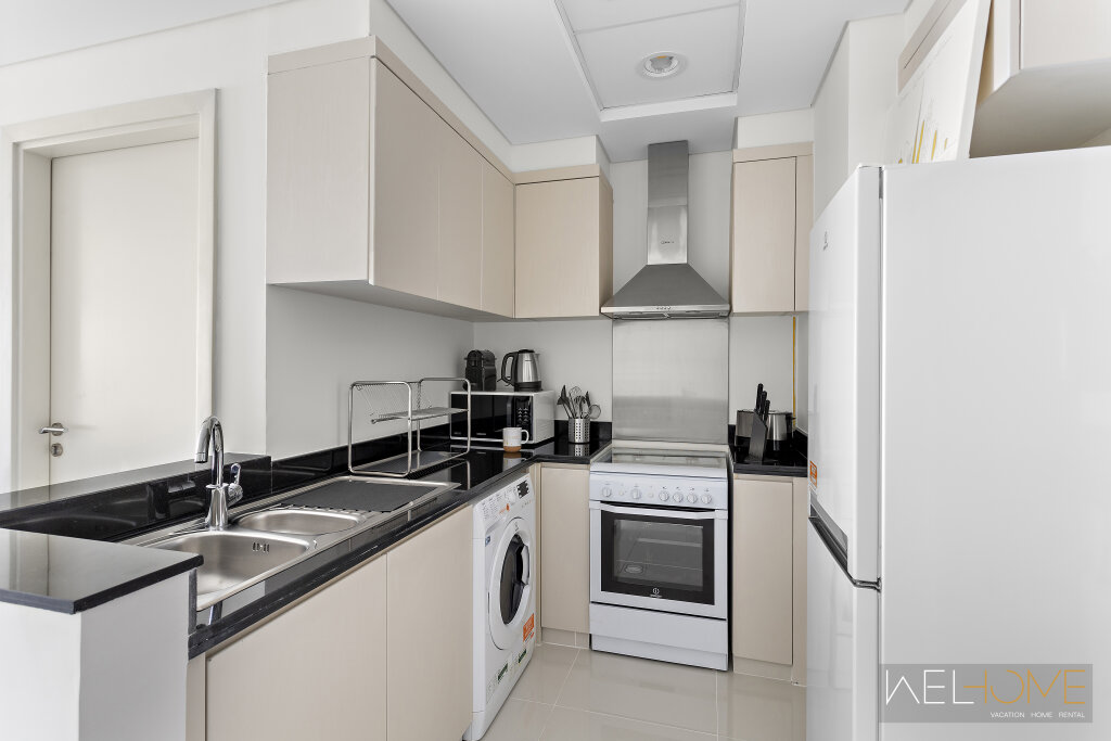Дубай: Апартаменты WelHome - Breathtaking 1BR Apt with Balcony and City View
