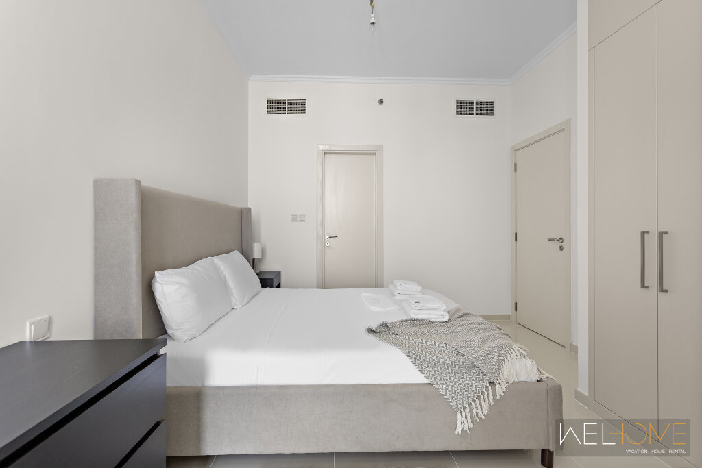 Дубай: Апартаменты WelHome - Breathtaking 1BR Apt with Balcony and City View