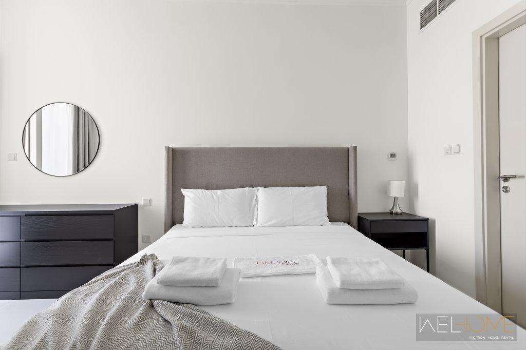 Дубай: Апартаменты WelHome - Breathtaking 1BR Apt with Balcony and City View