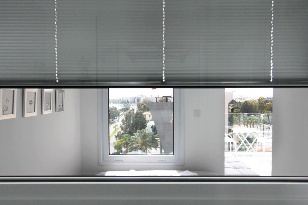 Лимассол: The White Pearl Suite - beach front city centre with sea view.
