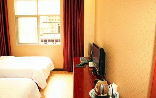 Эньши: Enshi Qingju Business Inn