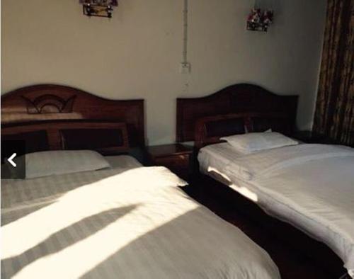 Эньши: Huiweilou Guest House