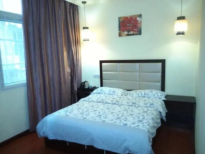 Эньши: Tongxing Business Hotel