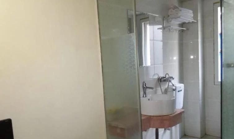 Эньши: Tongxing Business Hotel