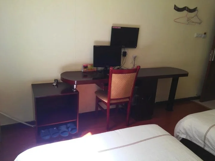 Эньши: Tongxing Business Hotel