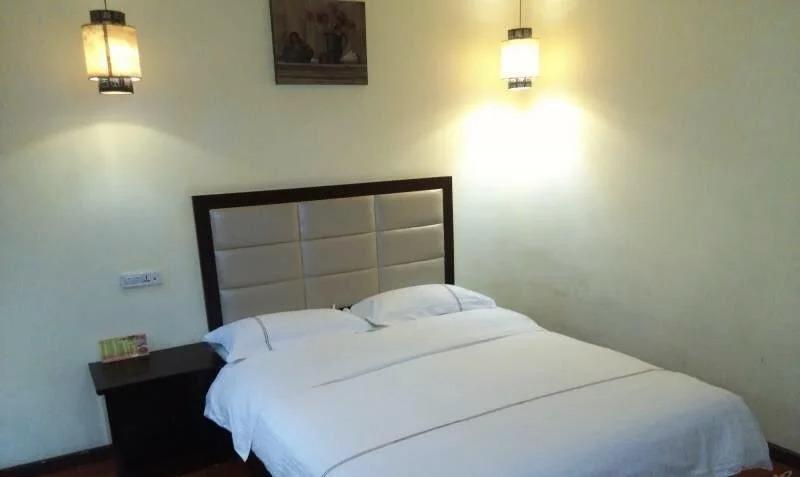Эньши: Tongxing Business Hotel