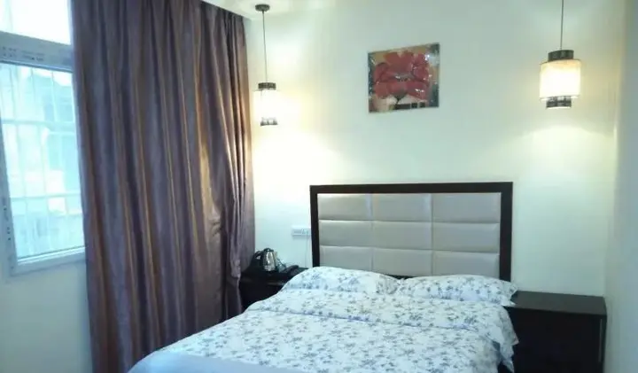 Эньши: Tongxing Business Hotel