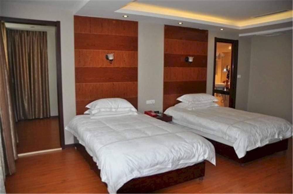 Эньши: Enshi Xihe Business Hotel