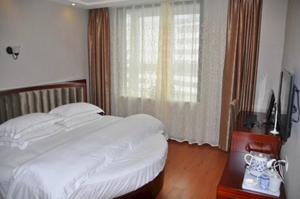 Эньши: Enshi Xihe Business Hotel