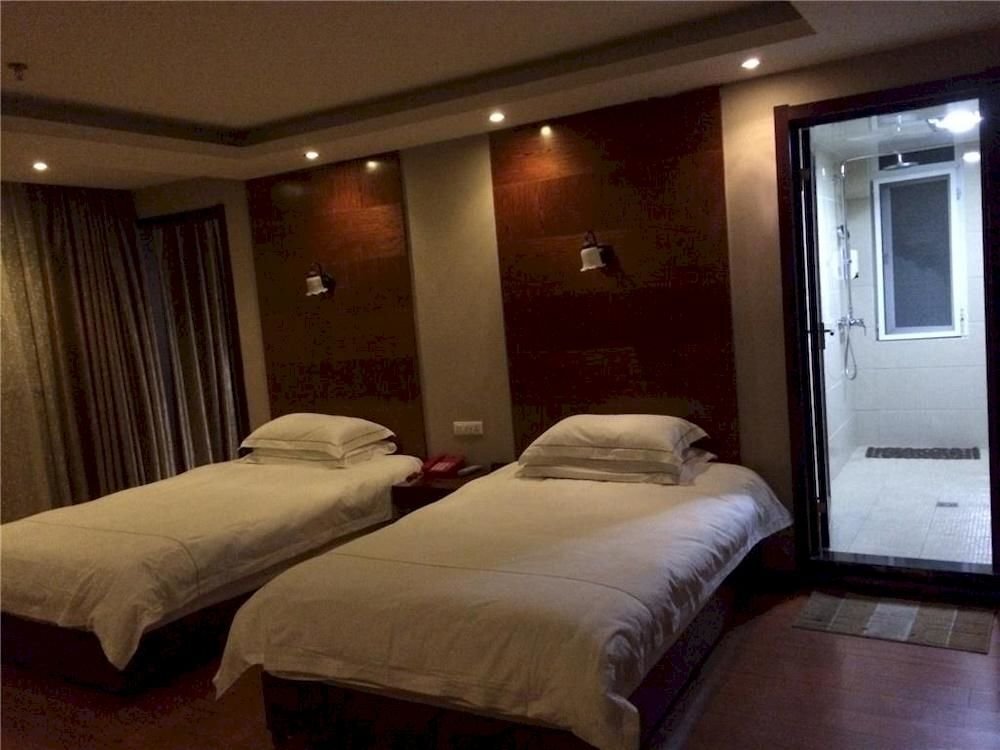 Эньши: Enshi Xihe Business Hotel