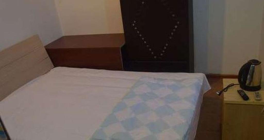Циндао: Qingdao Guanglongju Inn