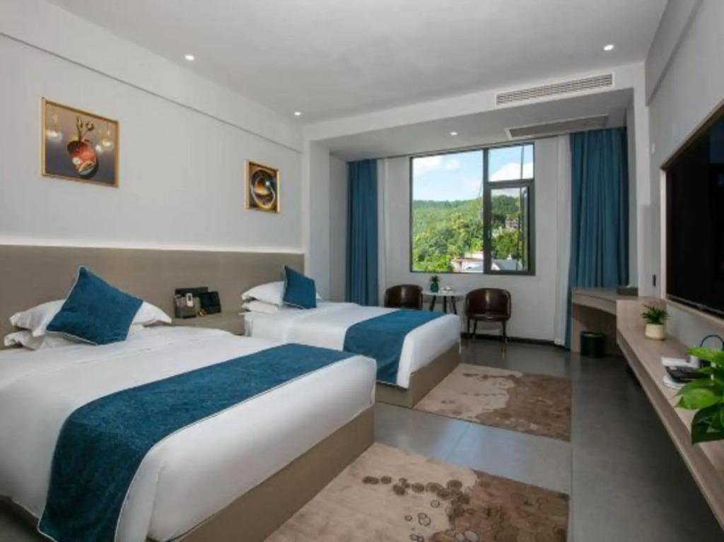 Мэнла: Jinjiangyuan Hoilday Hotel
