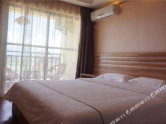 Цзинхун: Xishuangbanna Shibao Business Hotel