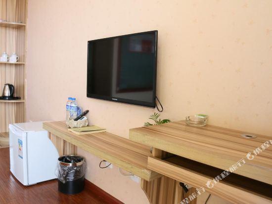 Цзинхун: Xishuangbanna Shibao Business Hotel