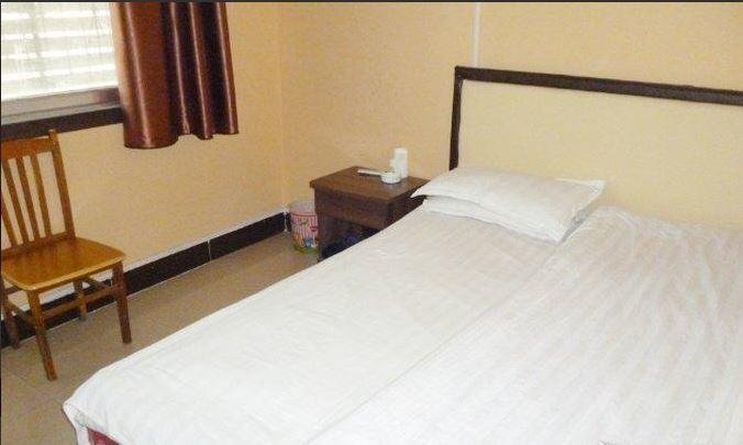Цзинин: Yanzhou Garden Inn