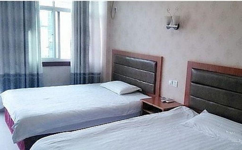 Шанграо: Jinxin Business Hotel