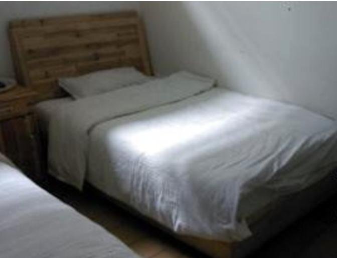 Цзинин: Qufu Ruiyuan Business Inn