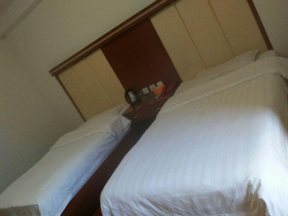 Яань: Yi Xin Business Inn
