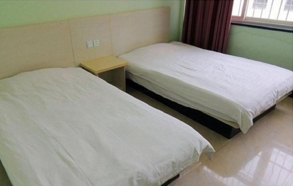 Цзинин: Jining Shengdi Business Inn