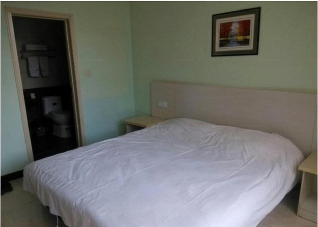 Цзинин: Jining Shengdi Business Inn