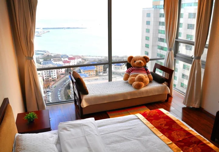 Циндао: QingDao JinShan We Holiday Apt Olympic C