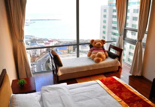 Циндао: QingDao JinShan We Holiday Apt Olympic C
