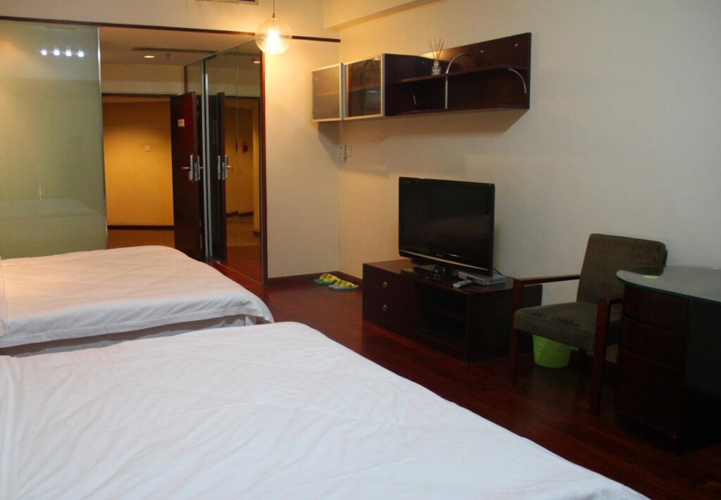 Циндао: QingDao JinShan We Holiday Apt Olympic C