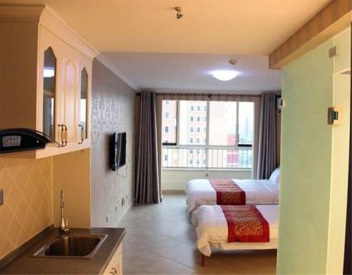 Циньхуандао: Nandaihe Zilanxiangjun Seaview Apartment