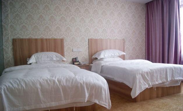 Либо: Libo Huatai Business Hotel