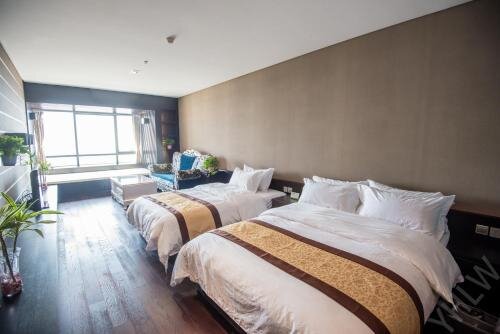 Циндао: Qingdao Yuehai Lanwan Seaview Resort Apartment