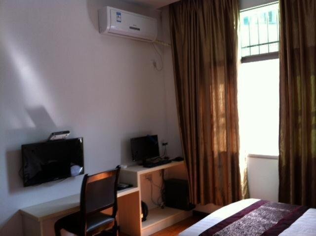 Эньши: Sunshine Business Inn