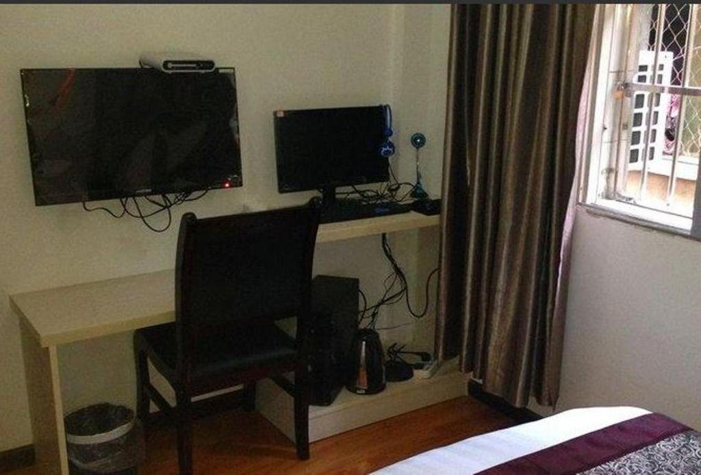 Эньши: Sunshine Business Inn
