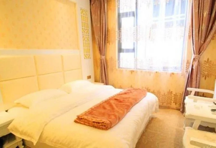 Дали: Mingge Busniess Hotel