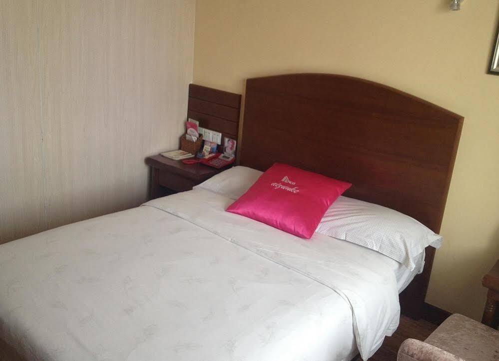 Циндао: Izunco Inn Qingdao TV Mansion