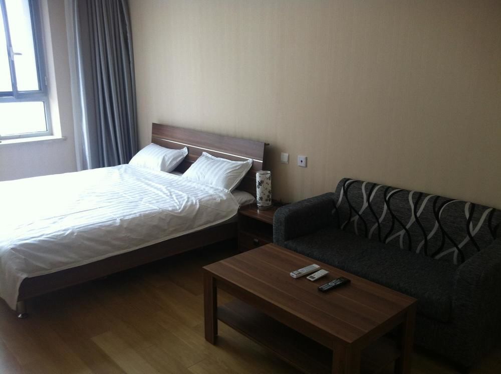 Dalian Yashige Hotel Apartment — фото 4