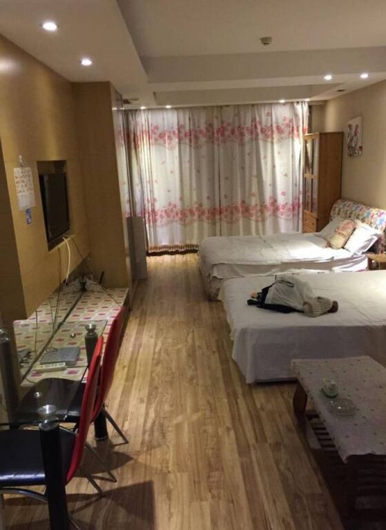 Далянь: Dalian Yijing Yuxuanting Hotel and Apartment