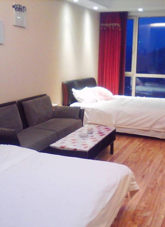 Далянь: Dalian Yijing Yuxuanting Hotel and Apartment