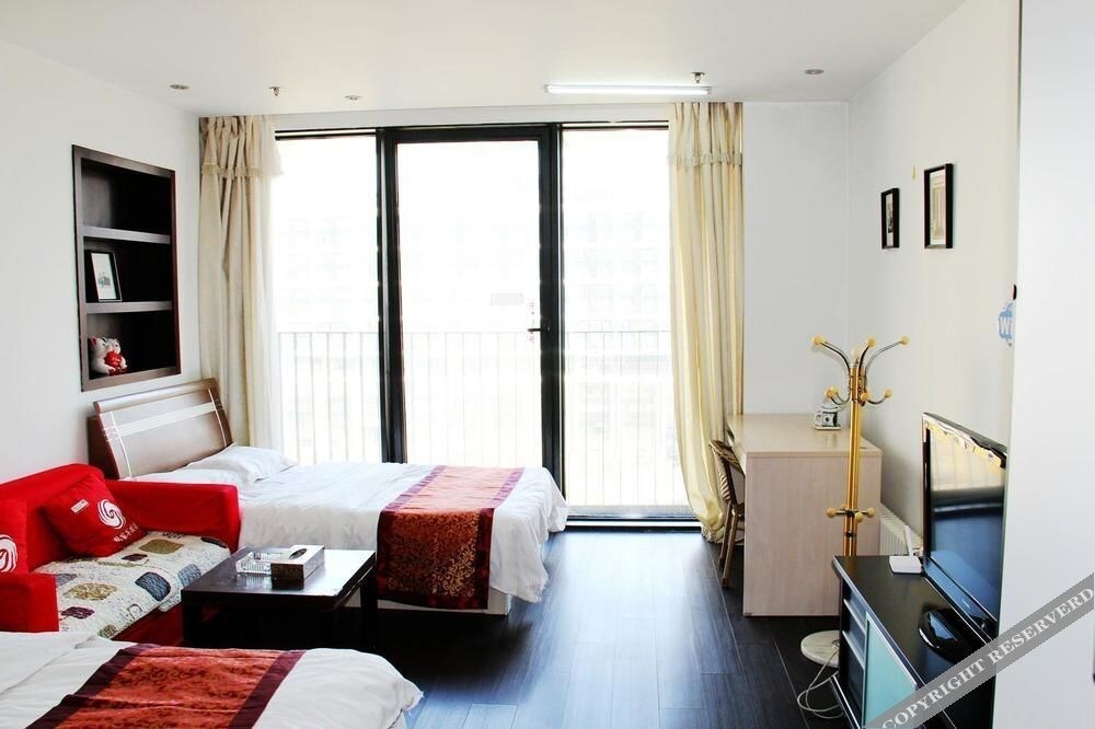 Далянь: Enji Apartment Hotel Bainianhui - Dalian