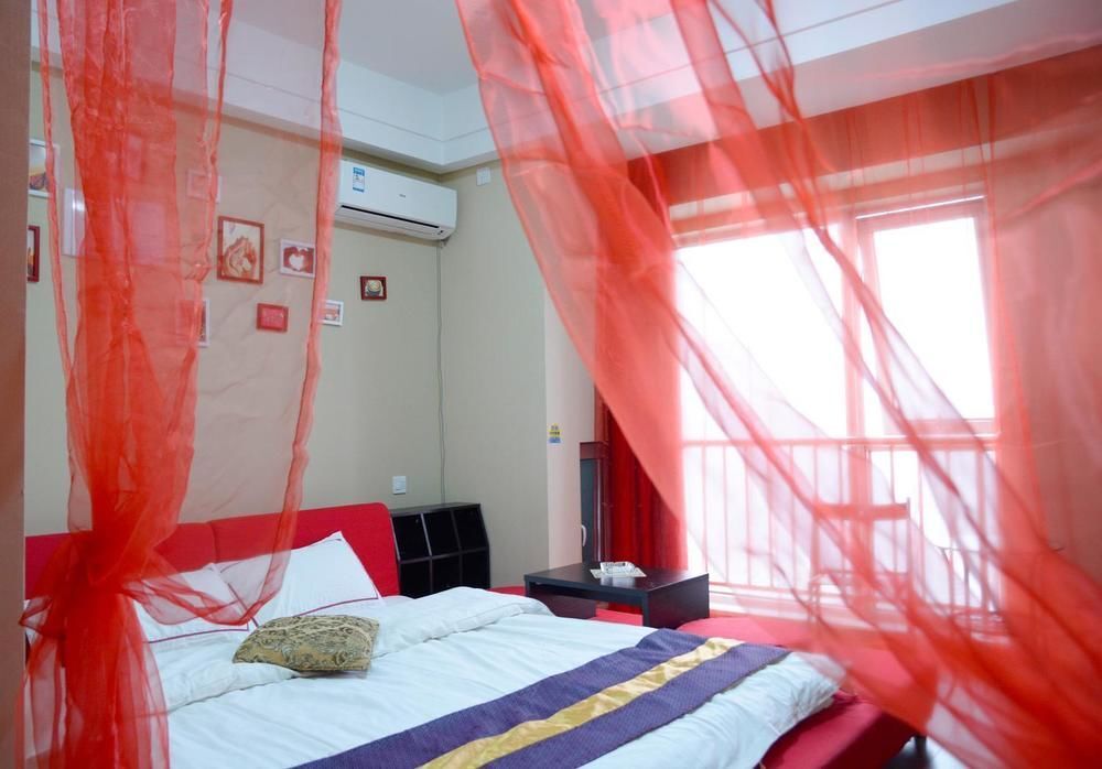 Далянь: Dalian Sea View Deluxe Apartment-wanda Plaza
