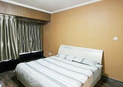 Далянь: Xinduhui Hotel Apartment