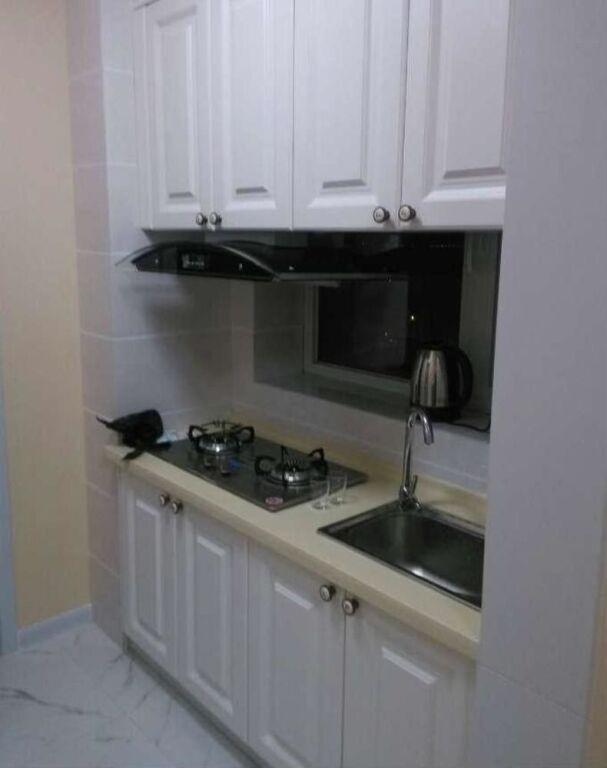 Далянь: Xinduhui Hotel Apartment