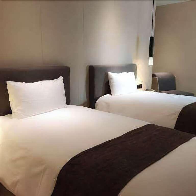Уси: Yitel Hotel